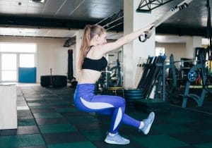 Woman doing squatting one leg exercise - Fitness Exercise